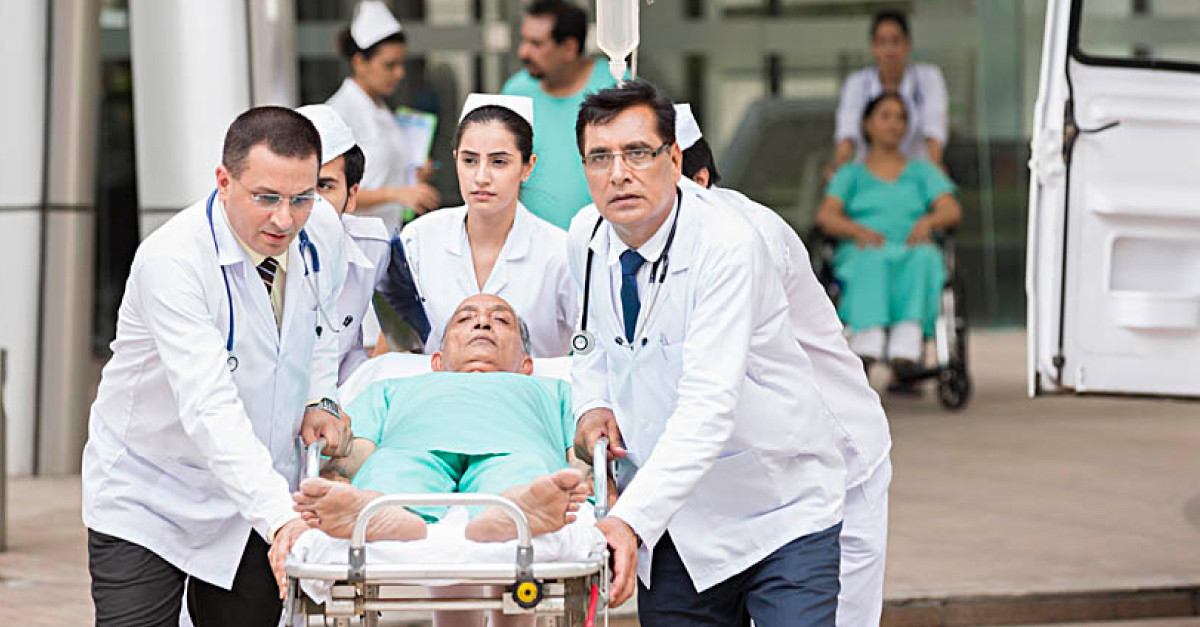 Emergency ward with doctors attending a patient